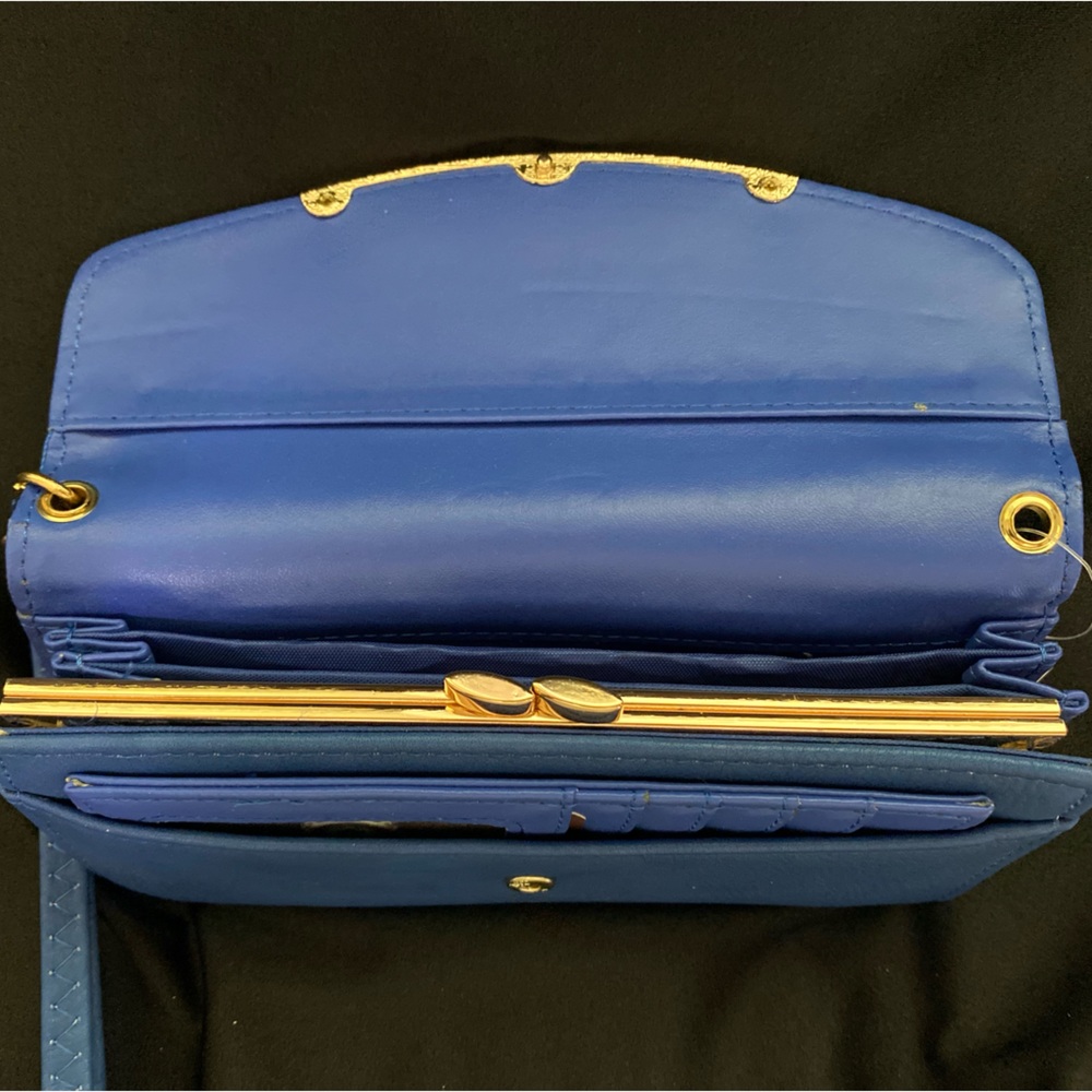 Bright blue soft wrist wallet.  New with tags.
